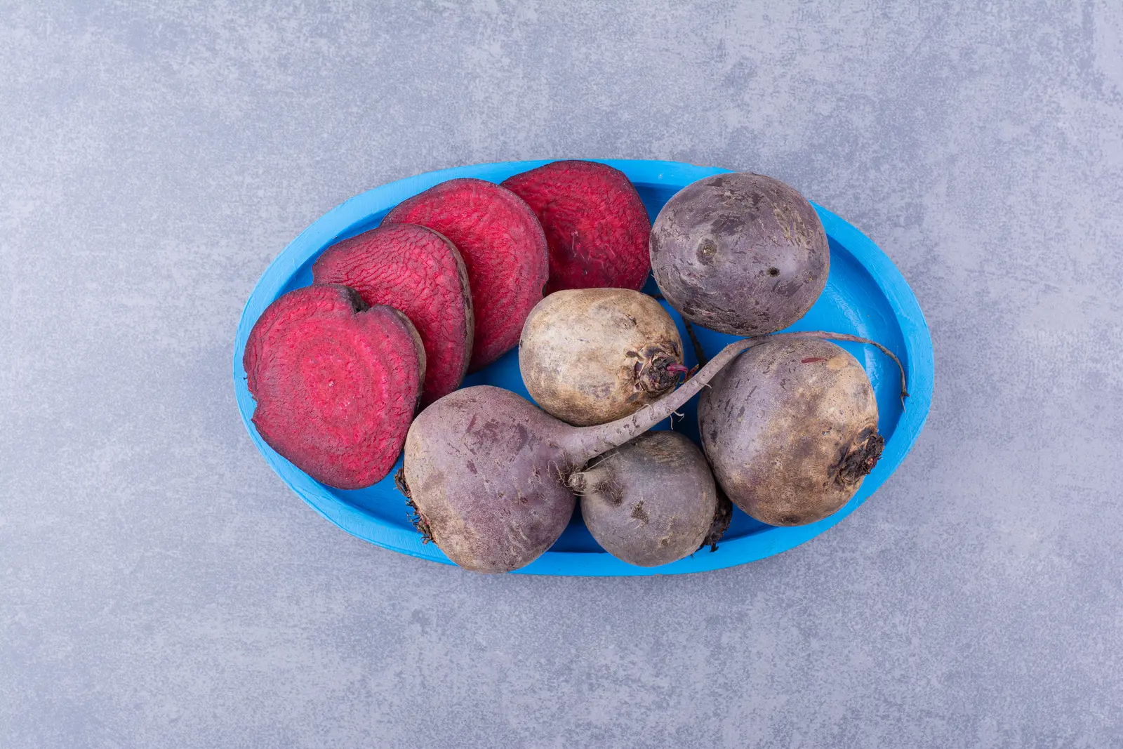 Organic beetroots on a blue platter