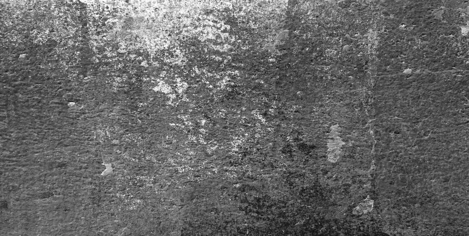 Tarnished silver on a concrete surface